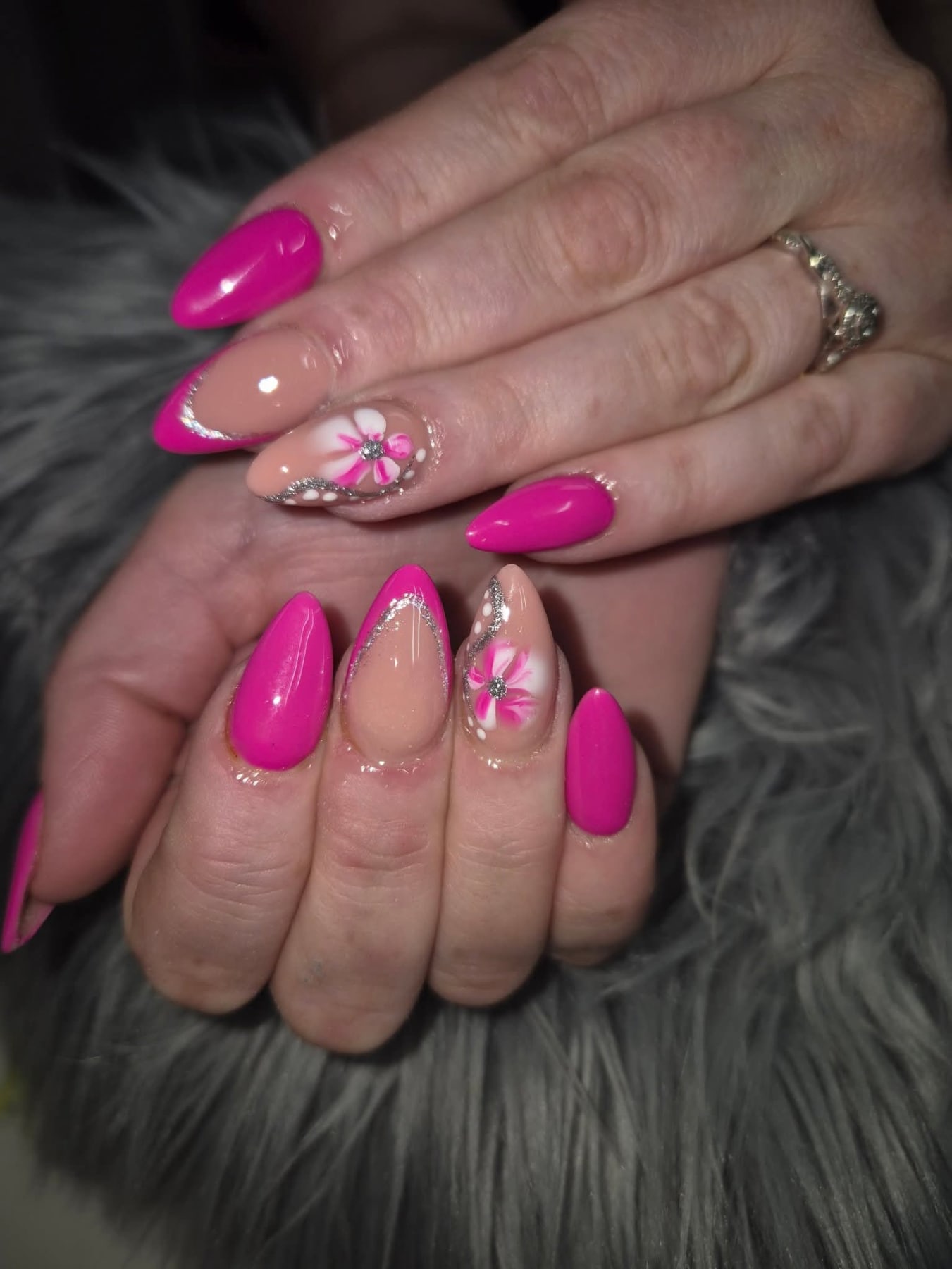 Hot pink almond nails with pink & white floral nail art